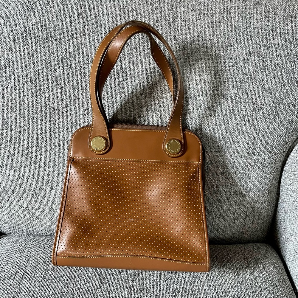 Dooney and Bourke medium size top handle tote style bag.